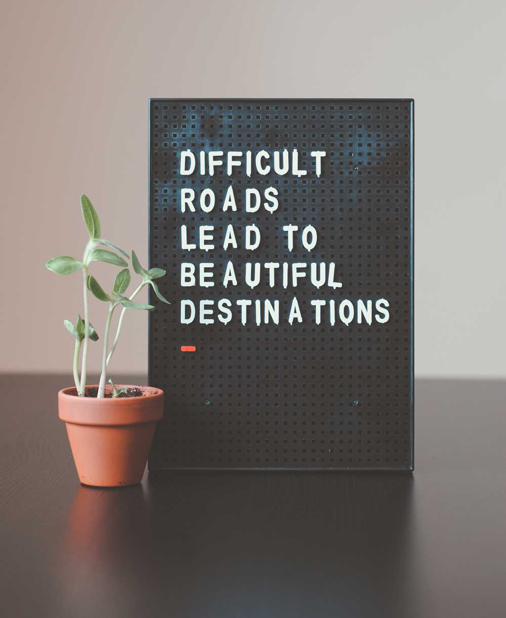 Sign: Difficult Roads Lead to Beautiful Destinations
