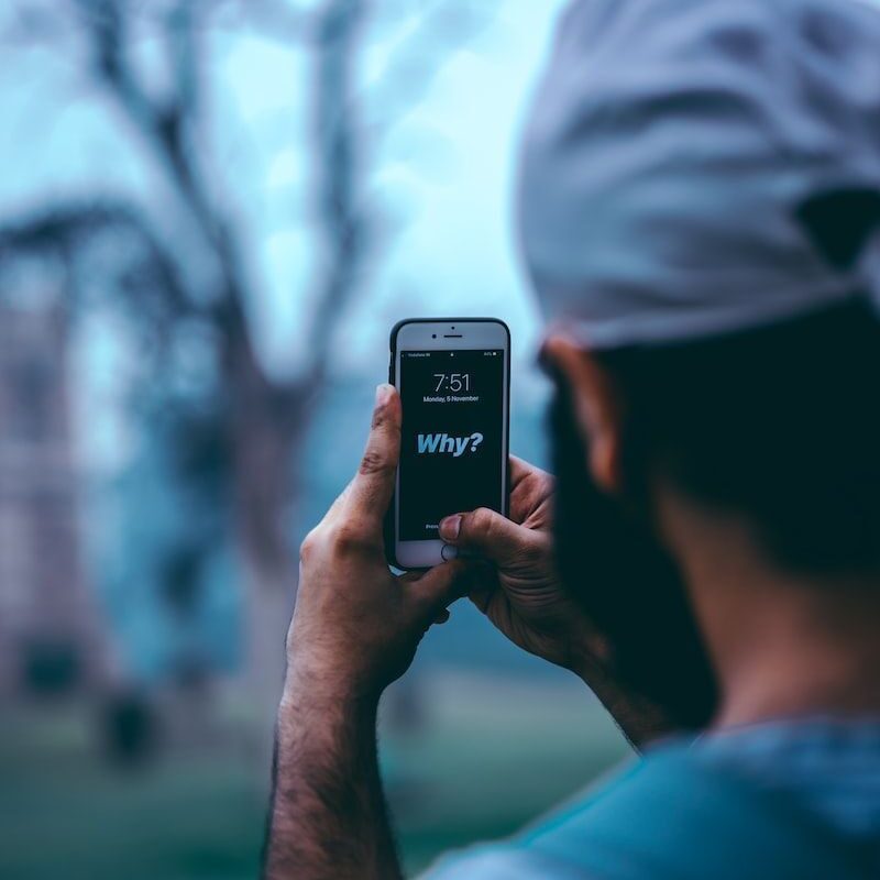 man using silver iPhone 6