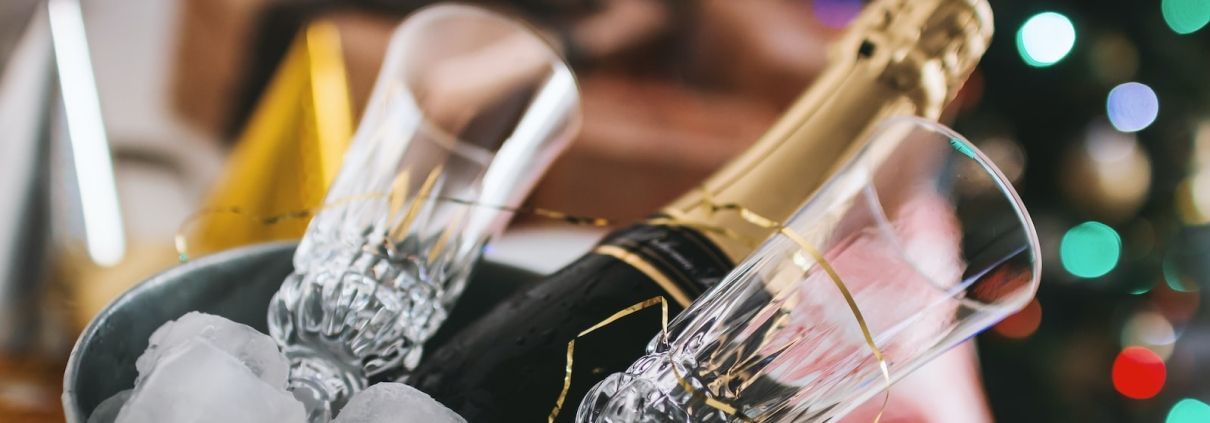 champagne bottle and glass in bucket