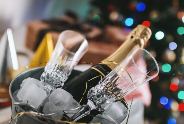 champagne bottle and glass in bucket