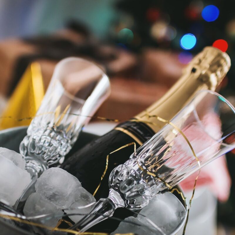 champagne bottle and glass in bucket