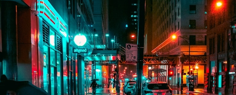 a person walking down a street holding an umbrella