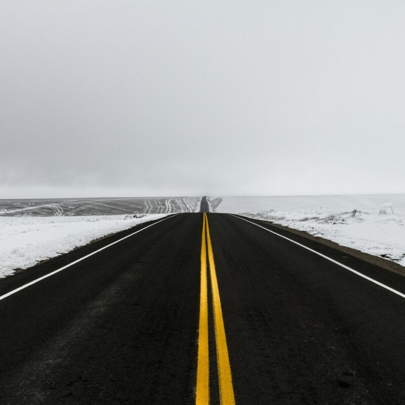 black and yellow road near sea